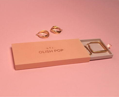 Kleine Kartonschleifschachteln mit rosa und goldene Folie